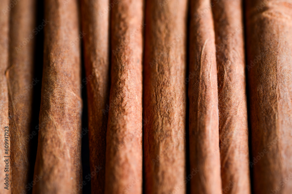 Orange cinnamon sticks with sun lights on the kitchen table. Orange cinnamon sticks with sun lights on the kitchen table.