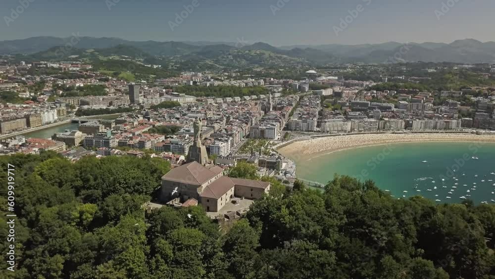 Aerial view of Motako Gaztelua with birds flying and San Sebastian in the background Aerial view of Motako Gaztelua with birds flying and San Sebastian in the background