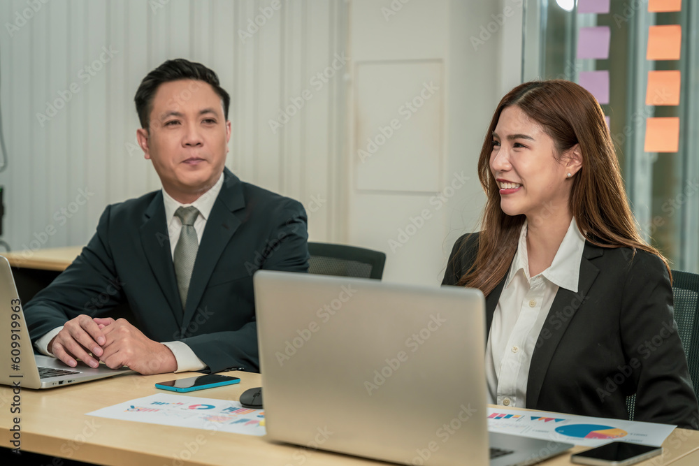 Modern Asian businessman with high confidence Committed to working together as a harmonious team Having a professional planning meeting at the company Modern Asian businessman with high confidence Committed to working together as a harmonious team Having a professional planning meeting at the company