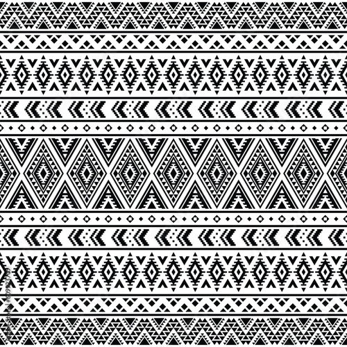 Geometric vector illustration design. Seamless ethnic pattern. Tribal Aztec style. Black and white colors. Design for textile, fabric, clothes, curtain, rug, batik, ornament, wrapping, paper.