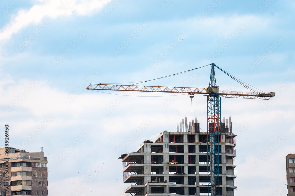 Construction of a new skyscraper and a crane Construction of a new skyscraper and a crane
