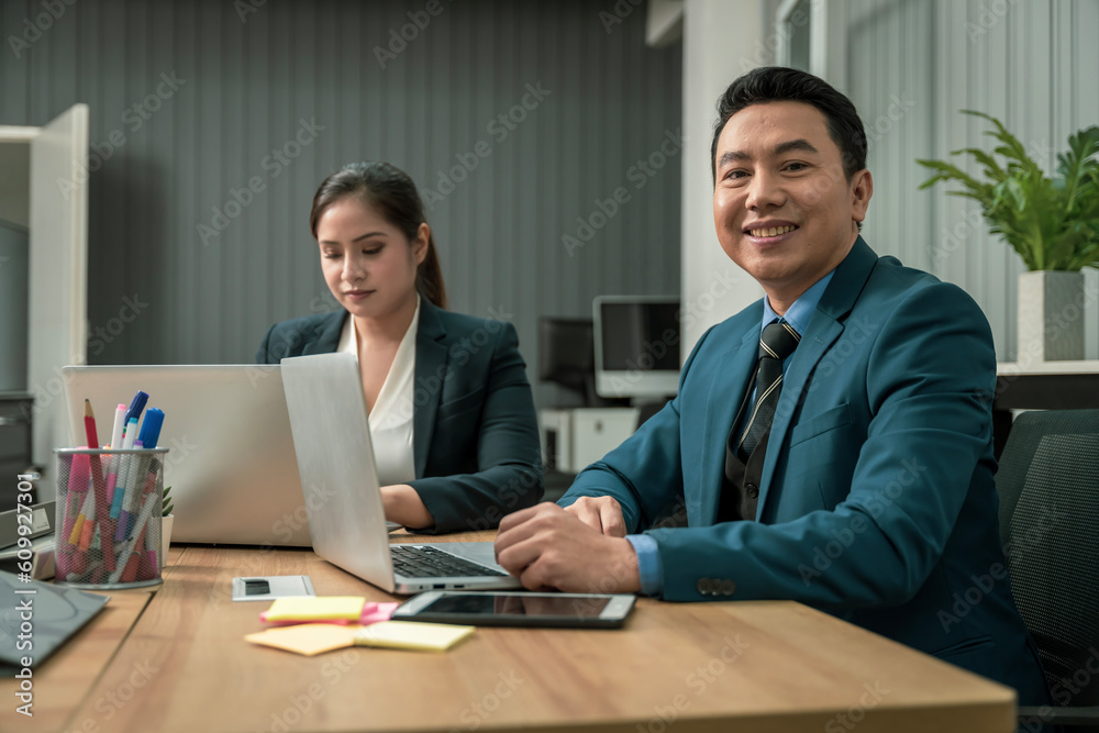 Modern Asian businessman with high confidence Committed to working together as a harmonious team Having a professional planning meeting at the company Modern Asian businessman with high confidence Committed to working together as a harmonious team Having a professional planning meeting at the company