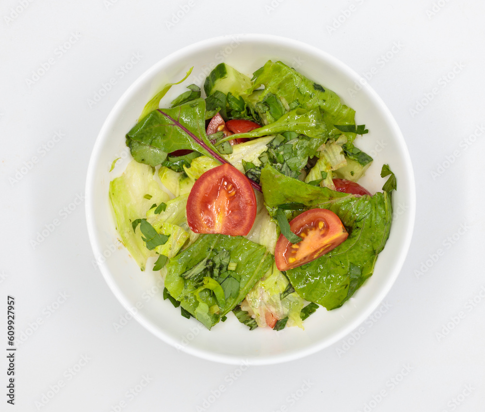 Fresh vegetable salad in a bowl. Isolate on white background Fresh vegetable salad in a bowl. Isolate on white background