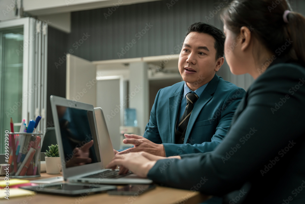 Modern Asian businessman with high confidence Committed to working together as a harmonious team Having a professional planning meeting at the company
