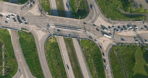 Aerial, drone, early morning or afternoon video of a diverging diamond interchange (DDI), located in Woodbury, NY.	 photo