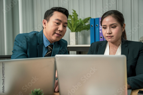 Modern Asian businessman with high confidence Committed to working together as a harmonious team Having a professional planning meeting at the company