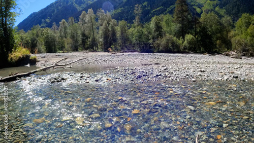 small clear cold river with beach rocks in Arkhyz mountain ridge - photo of nature