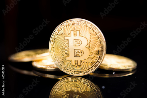 Bitcoin. Crypto currency Gold Bitcoin, BTC, Bit Coin. Macro shot of Bitcoin coins isolated on black background.