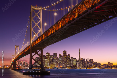 San Francisco view over bridge to city skyline at sunset