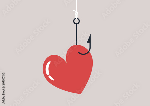 A heart hanging on a fishing hook, dangerous manipulations in relationships