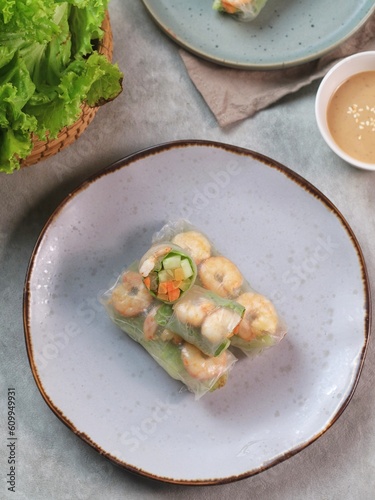Fresh summer rolls with shrimp and vetgetables,Vietnamese food for healthy food concept with salad dressing
