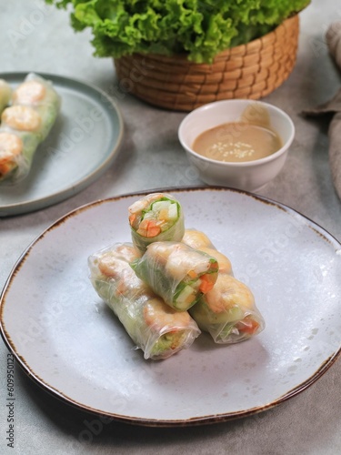 Fresh summer rolls with shrimp and vetgetables,Vietnamese food for healthy food concept with salad dressing 