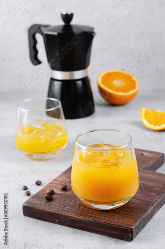 Orange Juice with Ice on Grey Background, Making of Refreshing Coffee Drink