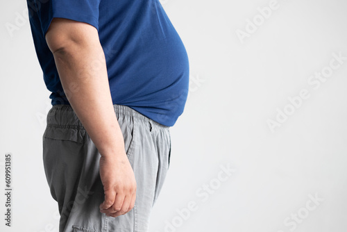 fat middle aged old asian man belly, concept of overweight, dad bod, over eating, obesity, unhealthy lifestyle