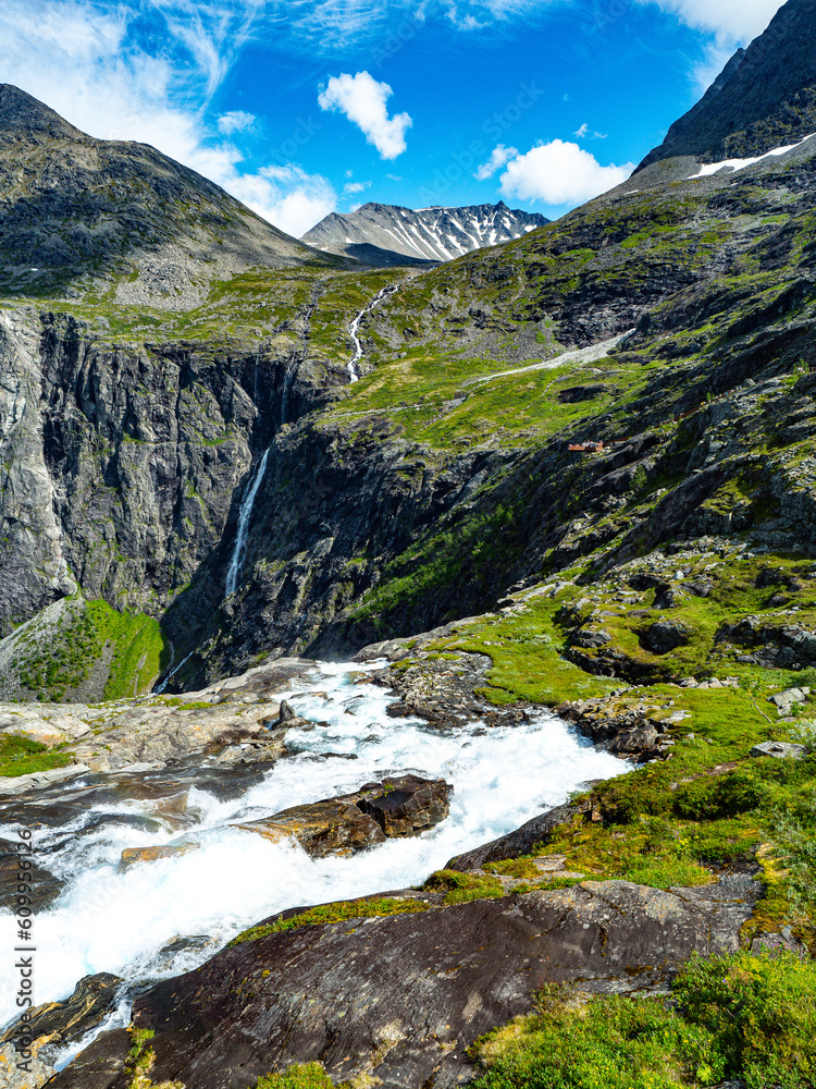 Trollstigen road in summer in Norway. View on mountain and waterfall. Trollstigen road in summer in Norway. View on mountain and waterfall.