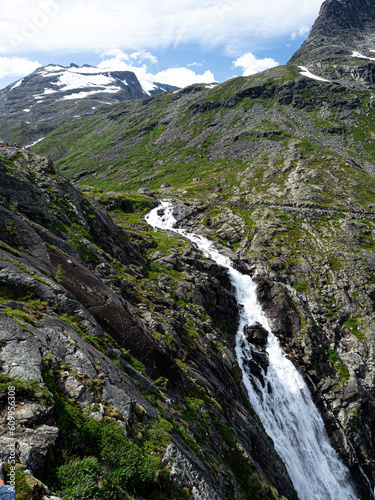 Trollstigen road in summer in Norway. View on mountain and waterfall.
