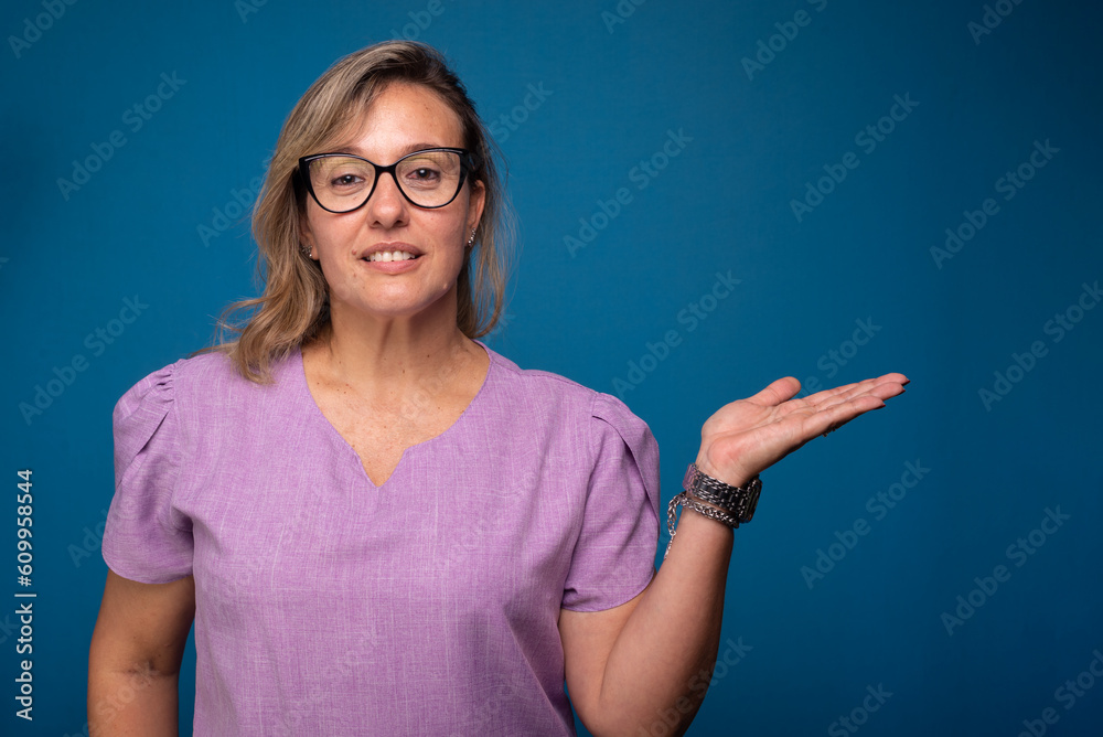 Pretty Brazilian woman, blonde, wearing lilac nurse uniform and making hand gestures. Pretty Brazilian woman, blonde, wearing lilac nurse uniform and making hand gestures.
