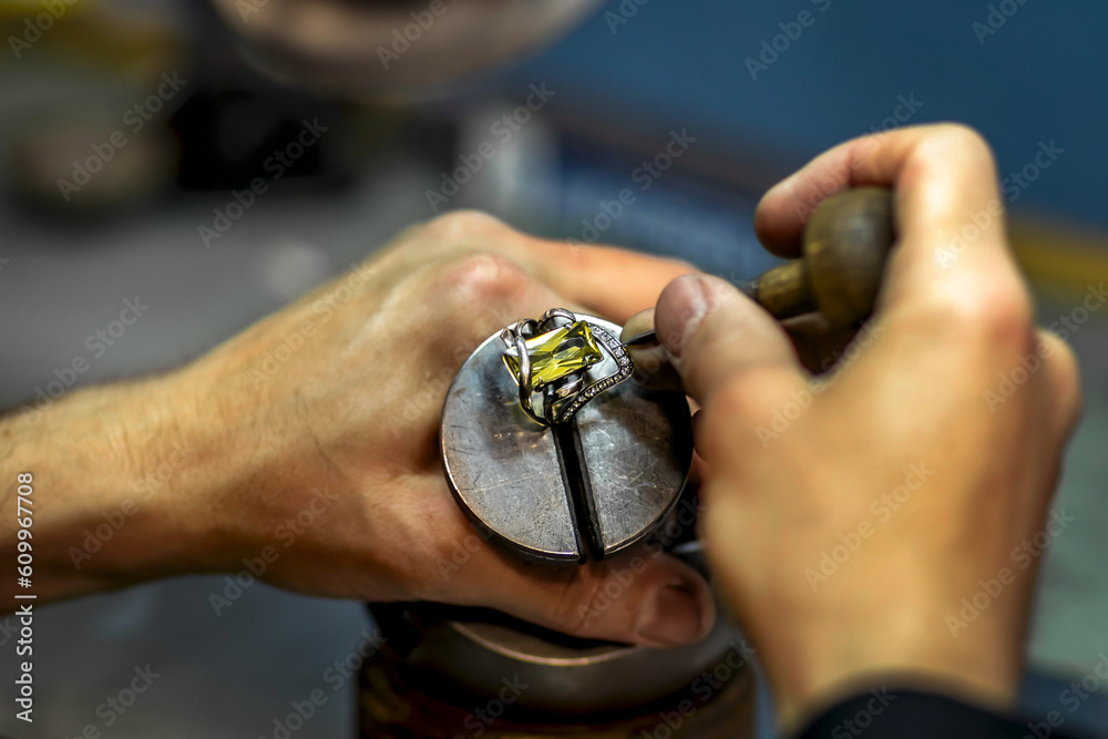 Fototapeta premium Jeweler's work on a gold item.