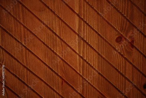 Wooden, obliquely profiled surface made of thin laths and boards. Background, pattern, surface or texture for further creative work