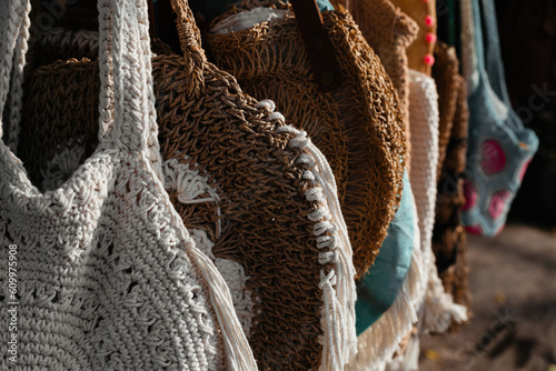 The texture of knitted bags close-up. Reusable textile bags in boho style photo