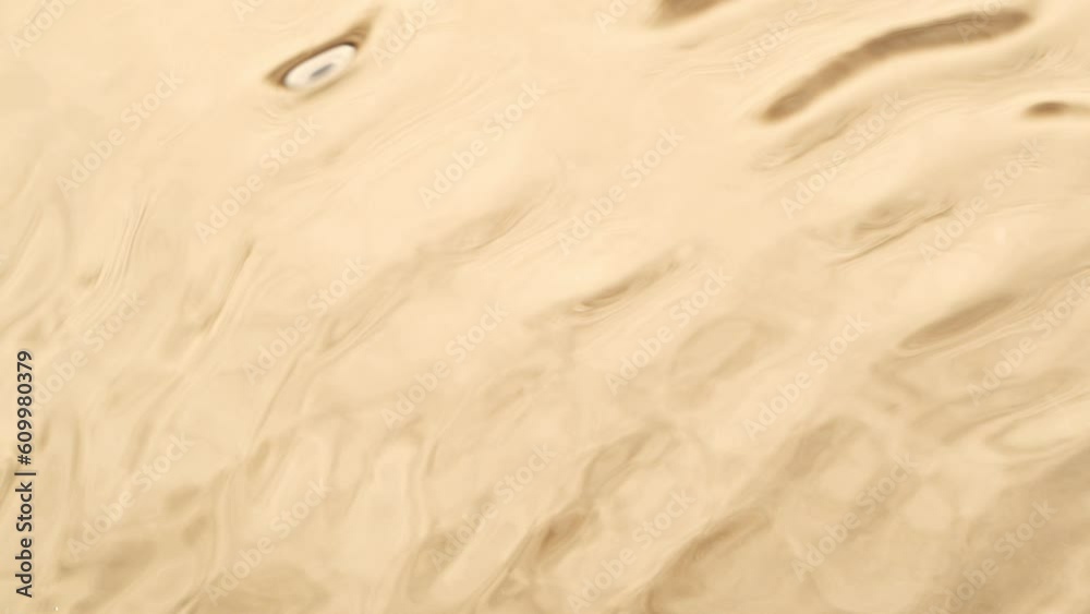 Super slow motion of water waves with sand texture. Filmed on high speed cinema camera, 1000 fps. Super slow motion of water waves with sand texture. Filmed on high speed cinema camera, 1000 fps.