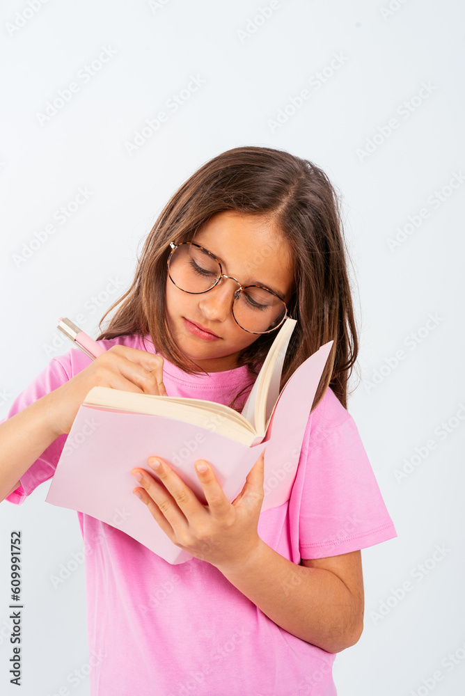 Young girl with notebook and pen Young girl with notebook and pen