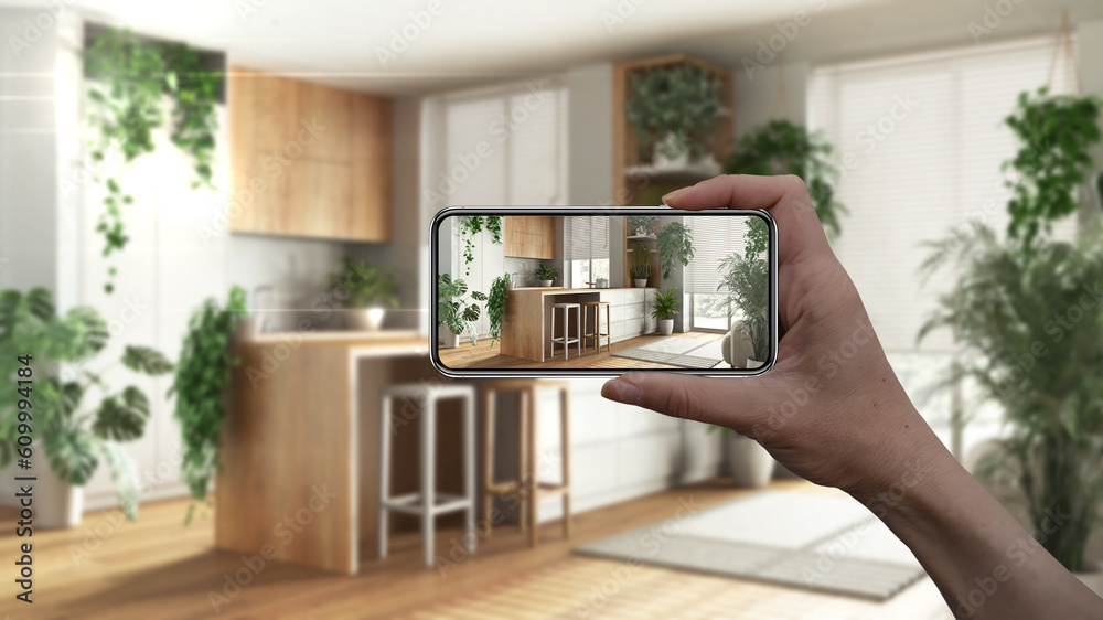 Hand holding smart phone, AR application, simulate furniture and ...