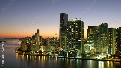 Wallpaper Mural Aerial Panning Shot Of Illuminated Modern Buildings By Sea Against Sky, Drone Flying Over City At Dusk - Miami, Florida Torontodigital.ca