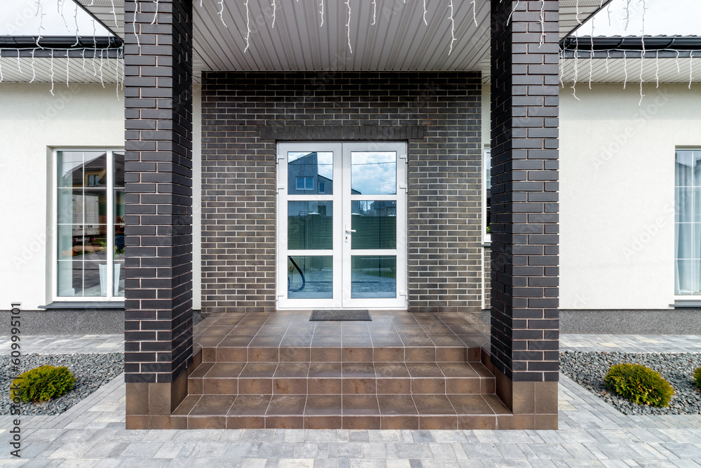 Fragment of a modern building lined with decorative bricks in the old style Fragment of a modern building lined with decorative bricks in the old style