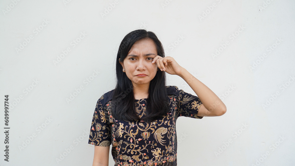 Portrait Asian women wearing batik cloth cry expression, sad, confusion