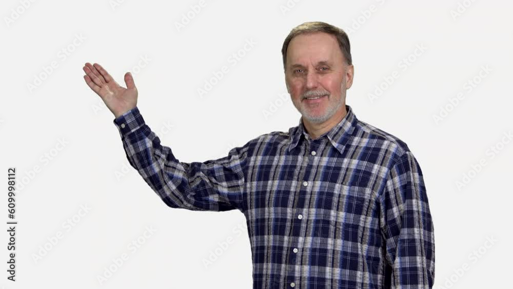 Handsome mature senior man is advertising copy space. Isolated on white background. Handsome mature senior man is advertising copy space. Isolated on white background.