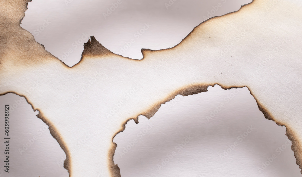 burning paper, glowing edge of paper on a white background burning paper, glowing edge of paper on a white background