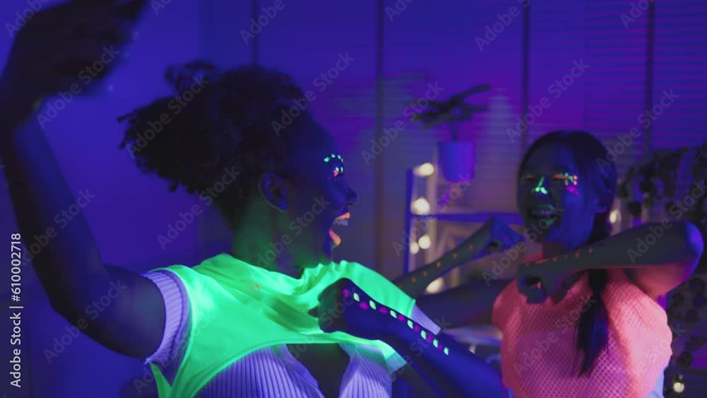 Neon asian woman dancing. Fashion model woman in neon light, portrait ...