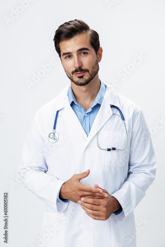 Man doctor in a white coat with a stethoscope smile with teeth and good test results looking into the camera on a white isolated background, copy space, space for text, health © SHOTPRIME STUDIO