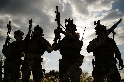 Принти на полотні Soldier holding gun and showing action success or war win, special forces military training concept