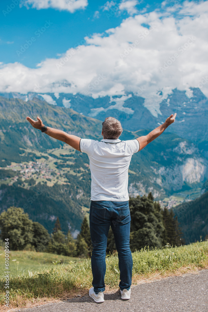 Young man hiking in Switzerland mountains Young man hiking in Switzerland mountains