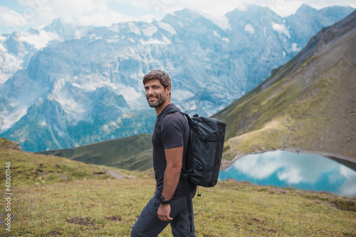 Young man hiking in Switzerland mountains