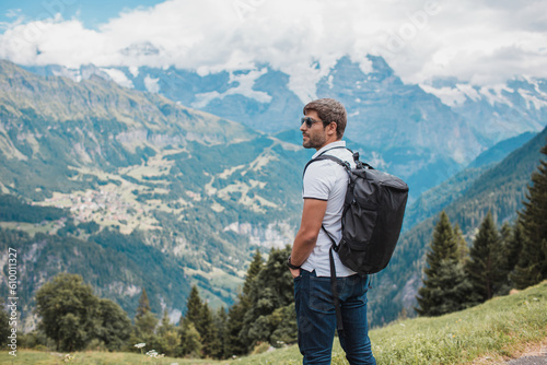 Young man hiking in Switzerland mountains