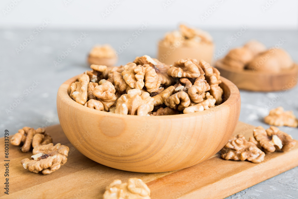 Fresh healthy walnuts in bowl on colored table background. Top view Healthy eating bertholletia concept. Super foods Fresh healthy walnuts in bowl on colored table background. Top view Healthy eating bertholletia concept. Super foods