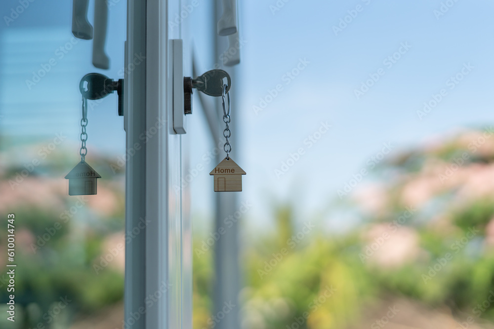 Landlord key for unlocking house is plugged into the door. Second hand house for rent and sale. keychain is blowing in the wind. mortgage for new home, buy, sell, renovate, investment, owner, estate.. Landlord key for unlocking house is plugged into the door. Second hand house for rent and sale. keychain is blowing in the wind. mortgage for new home, buy, sell, renovate, investment, owner, estate..