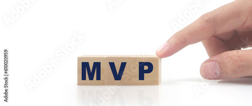 Wooden cube in hand with the letter from the mvp word