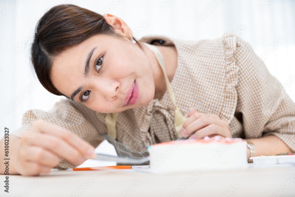asian female chef bake delicious dessert face flour dough cake bakery with sugar cream and strawberry bake in home kitchen, homemade cake