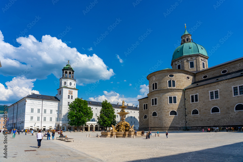 Fototapeta premium huge Residenzplatz main square in Salzburg with dome and fountain