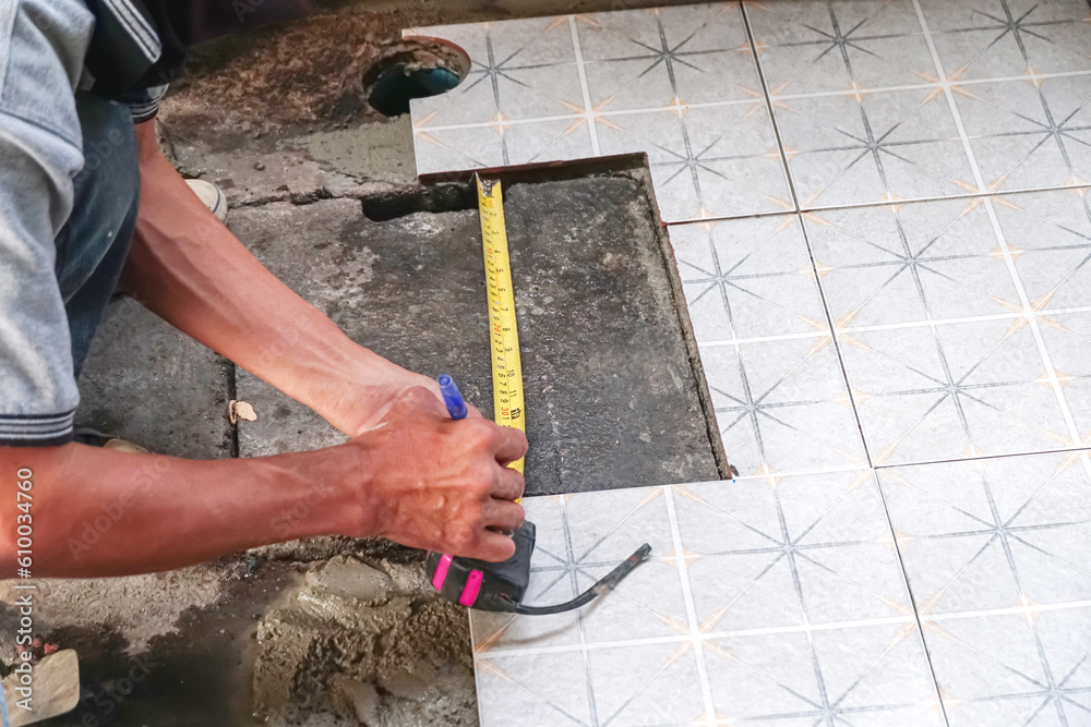 Installation of ceramic floor tiles, Workers are measuring to install floor tiles, install floor tiles.                                     