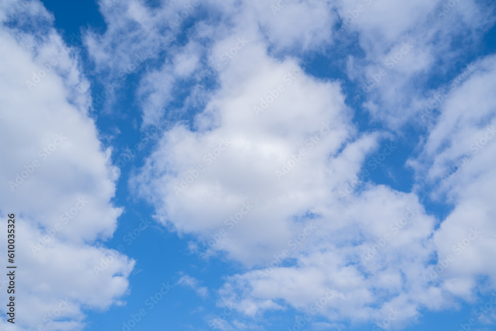 Obraz premium Bright blue sky with white clouds in spring