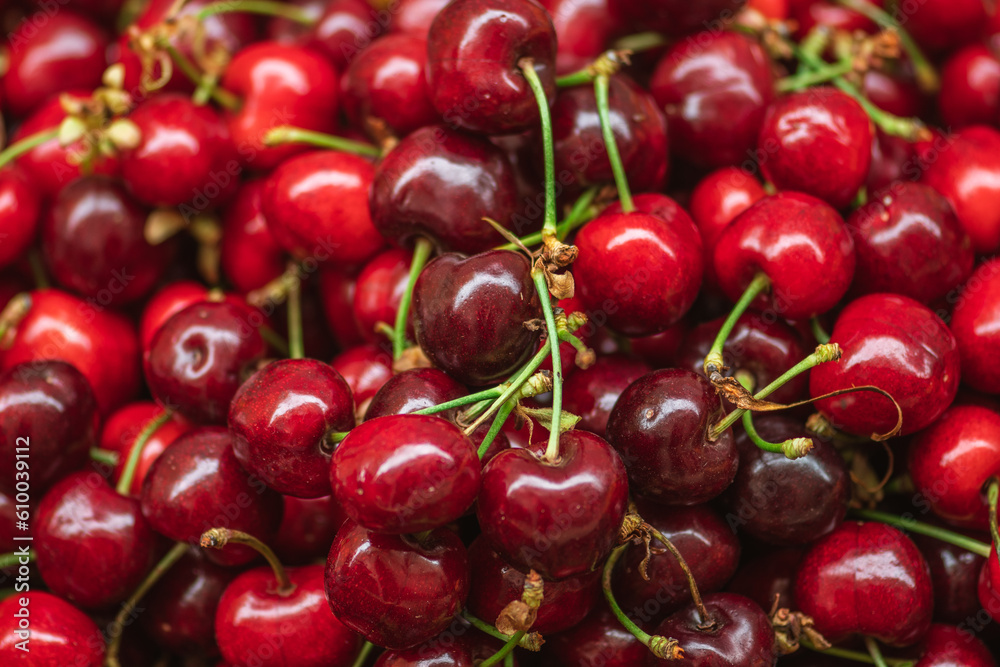 Fresh ripe red cherry or cherries fruit in a wooden box in a farmer agricultural open air market, seasonal healthy food. Concept of biological, bio products, bio ecology Fresh ripe red cherry or cherries fruit in a wooden box in a farmer agricultural open air market, seasonal healthy food. Concept of biological, bio products, bio ecology