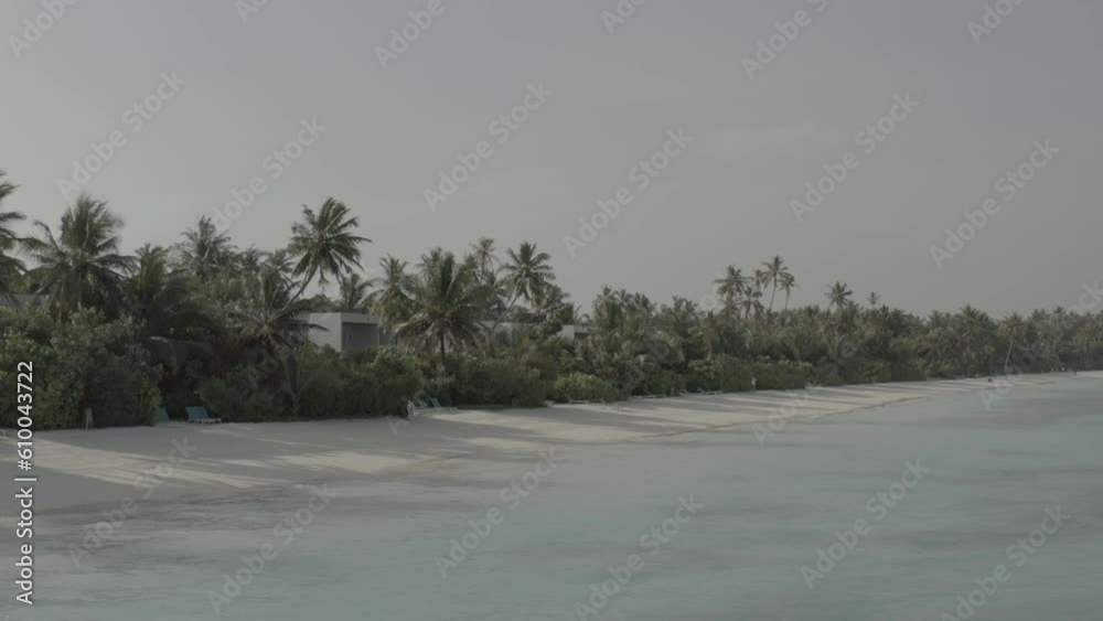 A beautiful bird's eye view of tropical islands in the Maldives. Aerial photography of exotic tropical islands. Footage without color correction.