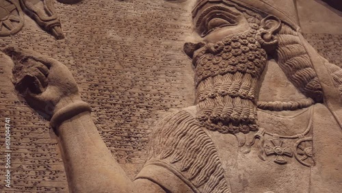 An Ancient Assyrian Carving of King on a Limestone Stele photo