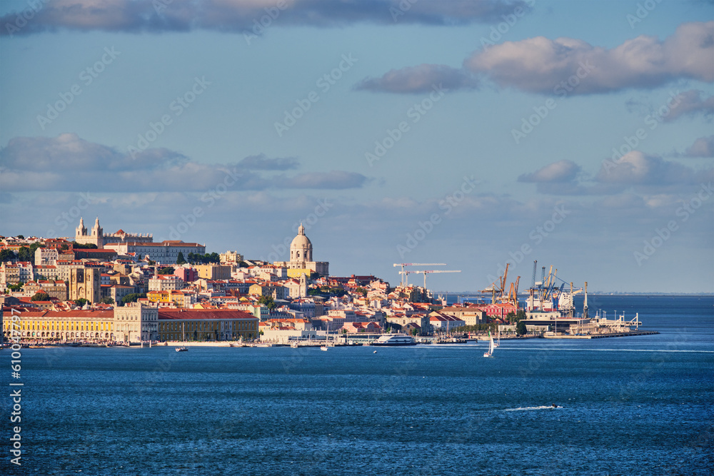 View of Lisbon over Tagus river from Almada with yachts tourist boats at sunset. Lisbon, Portugal
