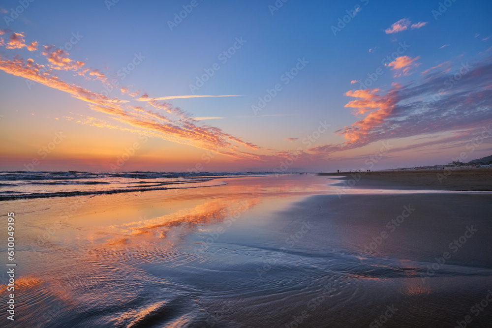 Atlantic ocean after sunset with surging waves at Fonte da Telha beach, Costa da Caparica, Portugal Atlantic ocean after sunset with surging waves at Fonte da Telha beach, Costa da Caparica, Portugal